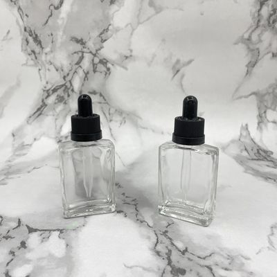 Glaskosmetik des Quadrat-30ml füllt kindersichere Kappe des Tropfenzählers für Haarpflege-Öl ab